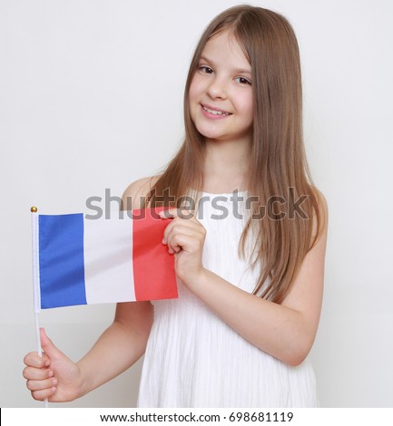 Caucasian teen girl holding Franch flag 