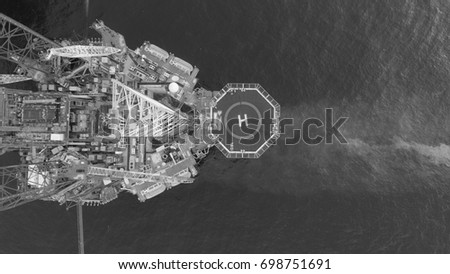 Areal photography from top view of jack up rig scenery with blue ocean view.