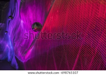 Beautiful abstract curved lines with the red & blue neon lighting background  Royalty-Free Stock Photo #698765107