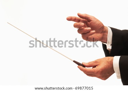 Music conductor hands with baton isolated on white background Royalty-Free Stock Photo #69877015