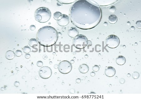 bubbles under water in white background Royalty-Free Stock Photo #698775241