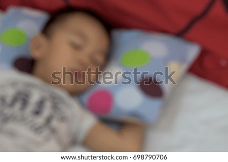 Blur image of a boy sleeping