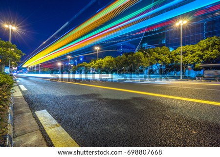 light trails in the downtown district, china.
