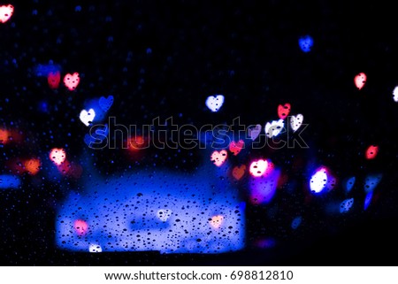 Bokeh heart vintage background on the  night road and raining after work