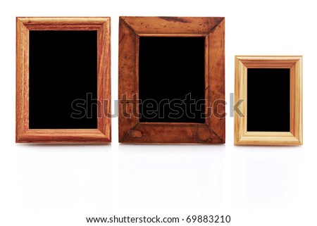 vintage wooden photo frames on white background with reflection