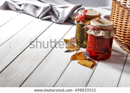 Autumn white table in the evening time with a cardboard background
