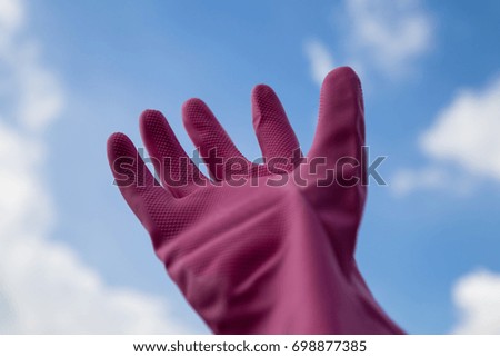 hand with pink glove
