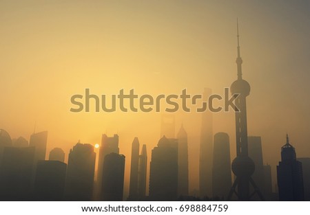 Shanghai skyline and business tower in sunny morning with cloud sky and misty cityscape view