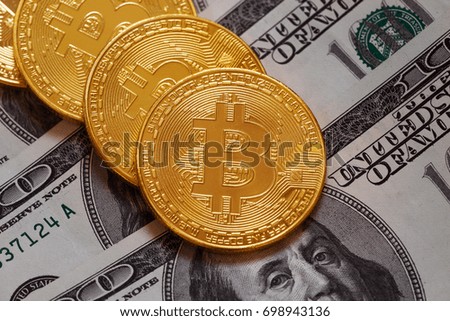 Golden bitcoins and hundred dollar bills. Virtual and real money concept
