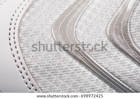 Sports shoes close up background. Texture of fabric macro background 