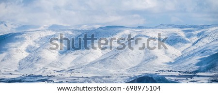 Snow-capped Anti-Lebanon mountain range between Lebanon and Syria Royalty-Free Stock Photo #698975104