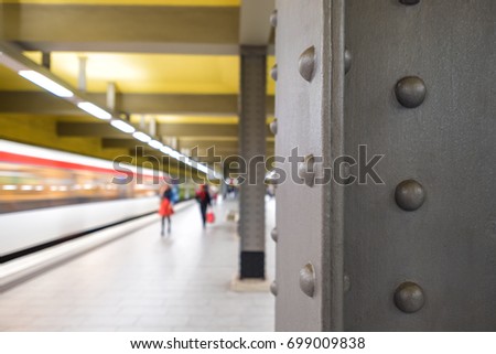 Underground station with arriving train