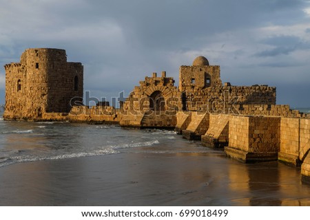 Ancient crusaders castle in Sidon, Lebanon during sunset Royalty-Free Stock Photo #699018499