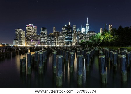 South Manhattan and financial district view from Brooklyn at night. New York City