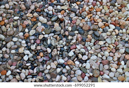 Pebble ground pattern, gray round gravel floor material, black soil circle surface, natural garden land backdrop, grey stone wall background, white marble rock soil texture.