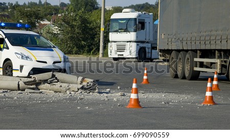 Road traffic cone and police on the accident site