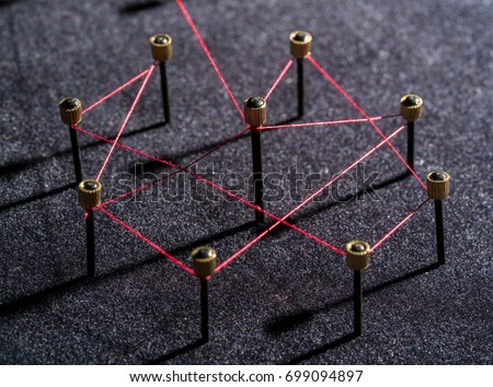 Concept of a social distancing network with leader of a management structure with linkages and interaction. Could illustrate coronavirus interactions and contact tracing Royalty-Free Stock Photo #699094897