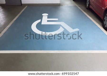 High angle view of handicap sign for parking in garage