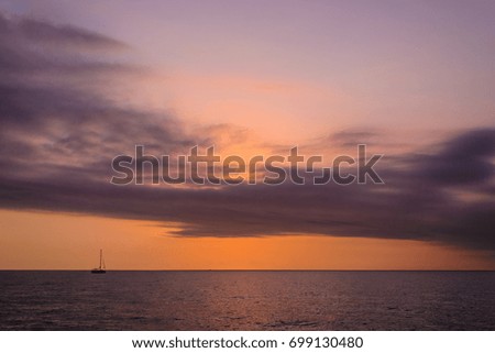 sea sun sunset sky clouds waves orange horizon ship