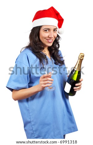 Friendly female doctor with christmas hat and champagne bottle