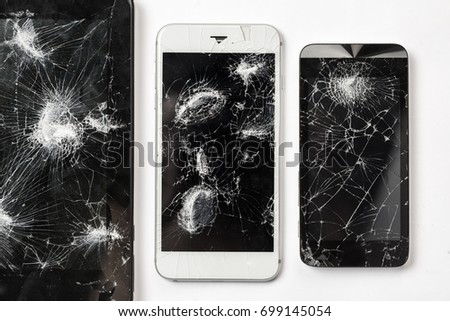 Cracked screen of smartphone mobile black glasses top view photography.