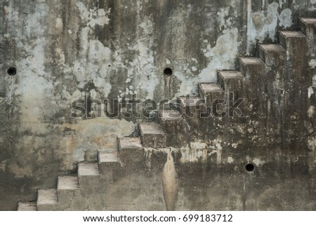 Old stairs built on a concrete wall filling full picture