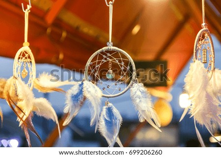 handmade dreamcatcher with bright feathers