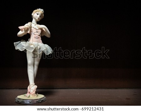Ballet Girl Doll Ceramic Stucco on Wood Background Royalty-Free Stock Photo #699212431