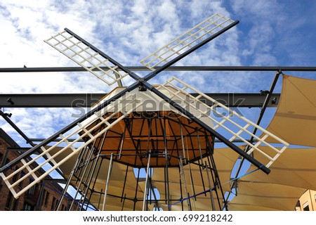 Windmill blades and sails under construction with blue sky background