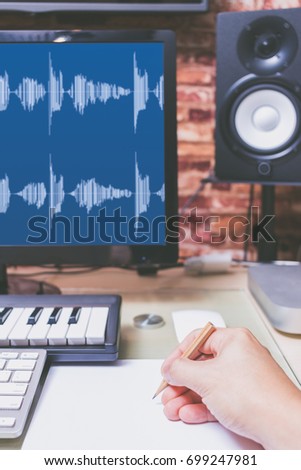 song writer working in digital recording home studio