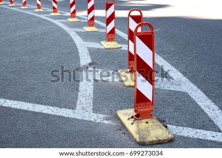 Striped road warning posts and road markings
