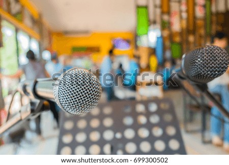 Close up microphone at conference in restaurant .