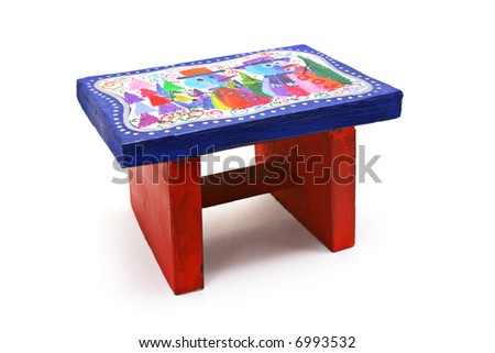 Children's handicraft - colorful stool with picture of Christmas snowmen and trees