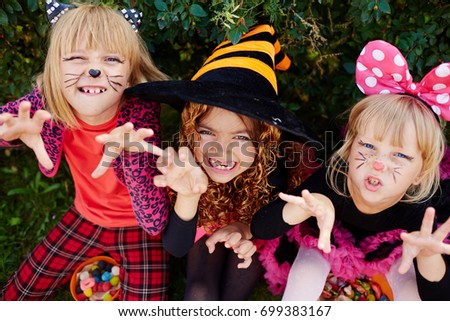 Scary halloween girls in costumes trying to frighten you
