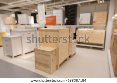 blur picture background  of wooden chest of drawer  or wardrobe in furniture mall
