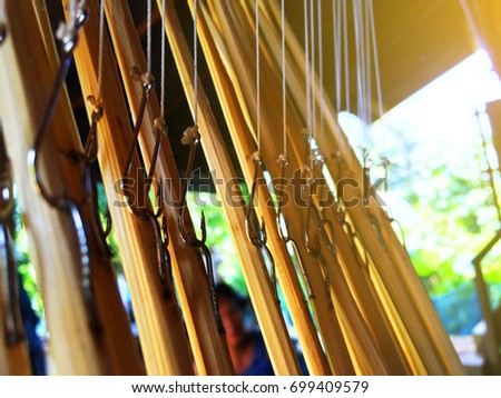 close up of pattern for Fishing hooks with fishing rod made of bamboo.
