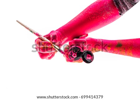 Paint artist art, creative concept of human hands with brush for drawing masterpieces. Colored red hands with tube of paint isolated on white background. Painter paints yellow and red colored sketch