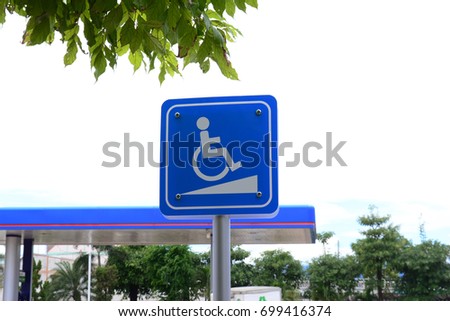 the sign of parking for the disabled at filling station