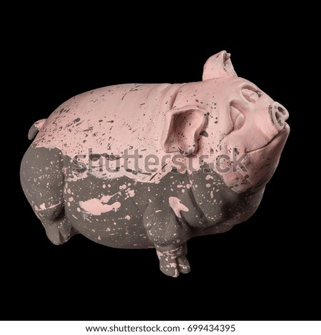 Rosy piggy statuette money box on a black background