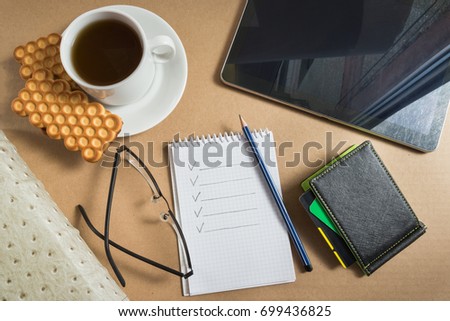 Mix of office supplies and business gadgets on office desk