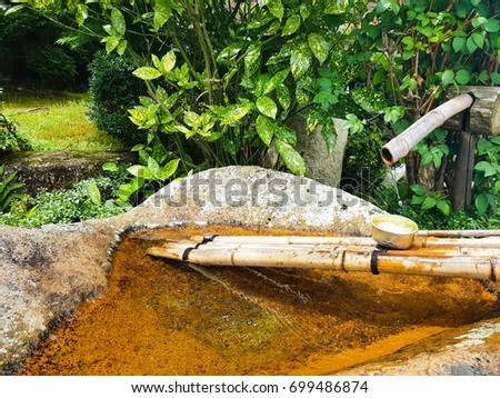 Bamboo water fountain in garden