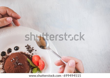 Tasting of delicious chocolate dessert for real gourmet. 