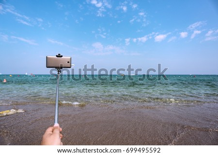 selfie stick and beach 