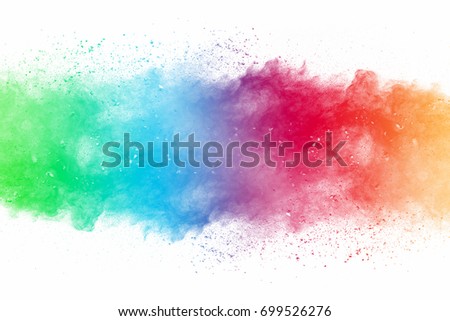 Abstract art powder paint on white background. Movement abstract frozen dust explosion multicolored on white background. Stop the movement of colored powder on white background. Royalty-Free Stock Photo #699526276