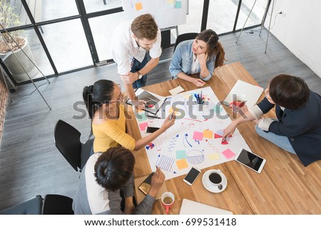 Group of five creative worker brainstorm together in office, new style of workspace, happy scene of people in office Royalty-Free Stock Photo #699531418