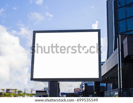 Blank billboard at skyscrapers backgound, mock up