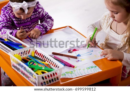  Little girl draws a picture