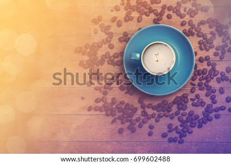 Cup of c�offee with shape heart on a wooden table.