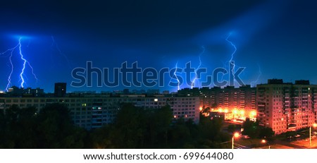 Thunderstorms and lightning above the city. Many lightning above the houses.