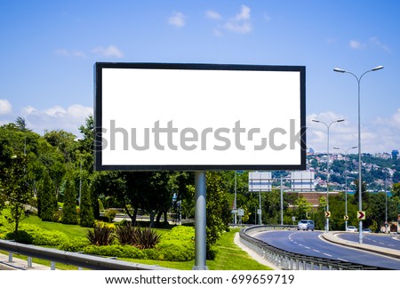 Blank white billboard against the blue sky